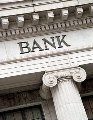 Frontispiece of a grand-looking building displaying the word “bank”. 