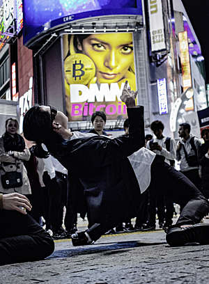 Ad for Bitcoin on Shibuya Crossing Intersection, Japan.