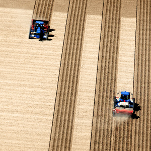 An aerial view of fields being plowed